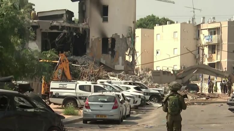 Hundreds of airstrikes bring buildings crashing down in Gaza as gun battles rage in Israel