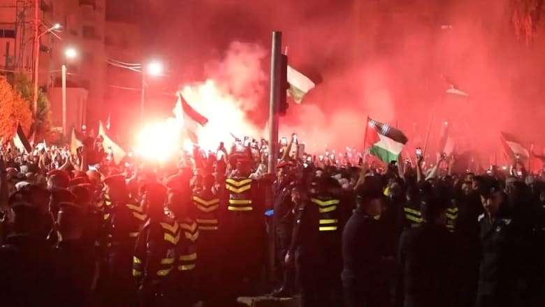 Thousands of protesters try to march on the Israeli Embassy in Amman