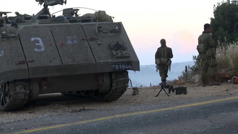 Israeli troops and tanks deployed on the Lebanese border
