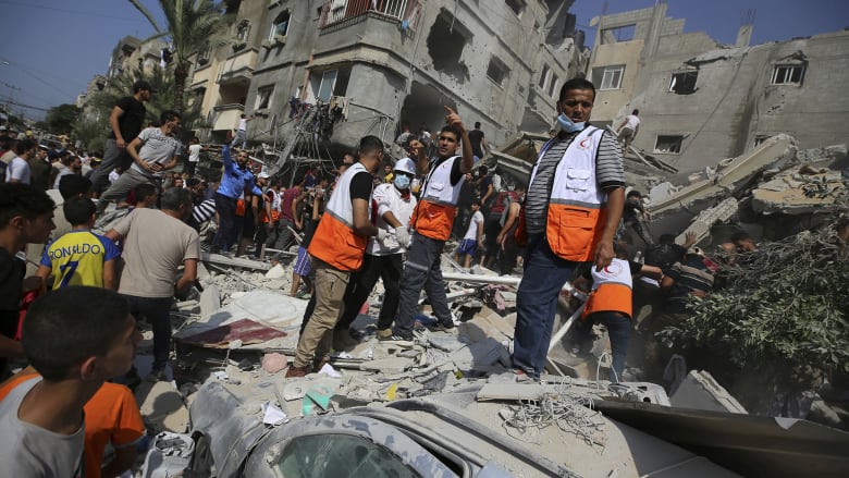 ‘There is no safety anywhere’: Airstrikes flatten buildings in Khan Younis