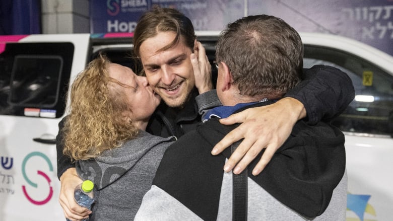 Watch: Freed Russian Israeli hostage enjoys emotional reunion with parents