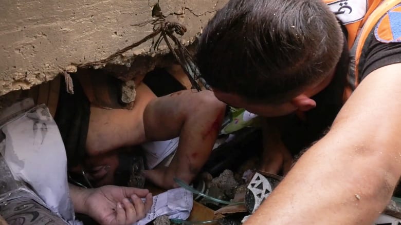 Rescuers scramble to pull survivors from flattened buildings in southern Gaza's Khan Younis