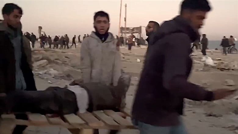 Israeli troops open fire on Palestinians waiting for aid in Gaza, health ministry says
