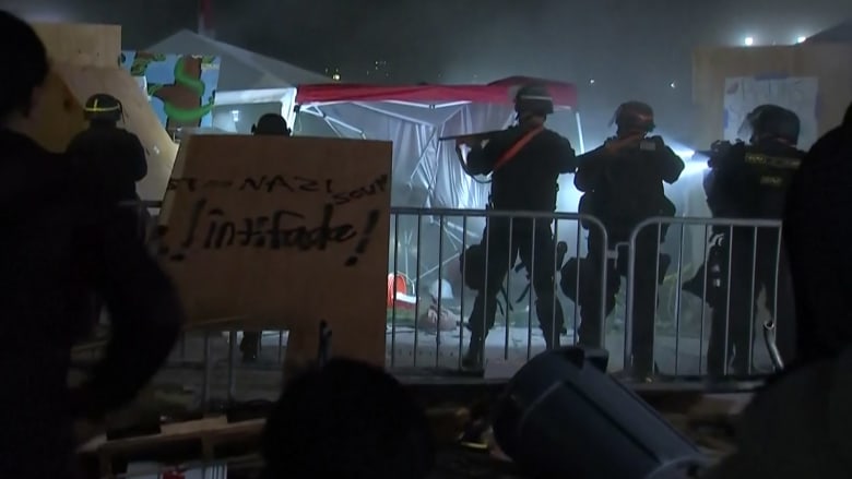 Protesters detained as police start to clear the UCLA encampment