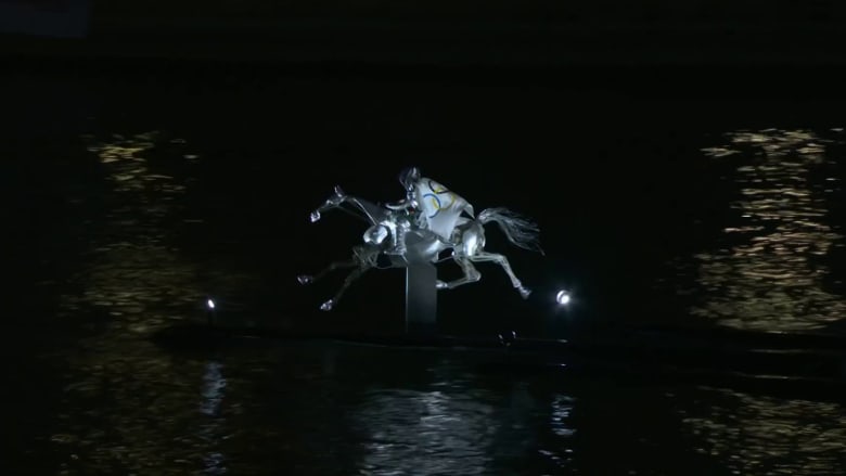 Watch: Metal horse gallops down Seine River at Olympics opening ceremony