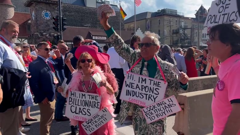 'Money out of politics!': Code Pink stages protest skit outside RNC