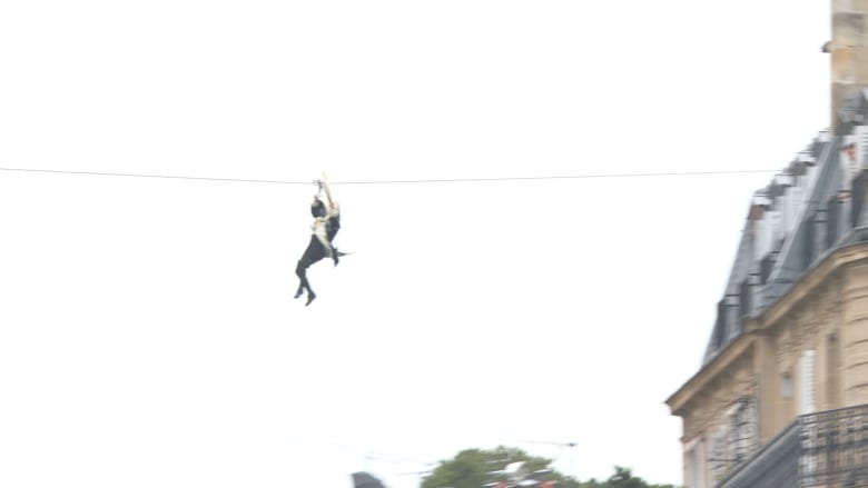 Olympic torch zip-lines over River Seine