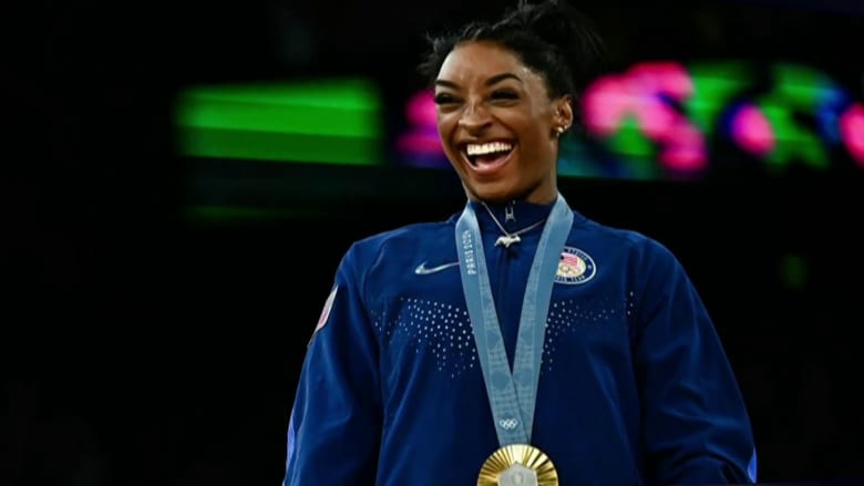 Biles strikes gold, again, in individual all-around competition