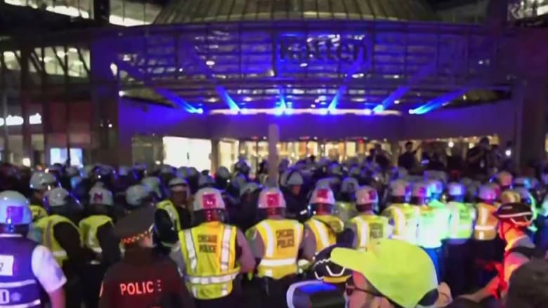 Pro-Palestinian protesters clash with riot police outside the DNC