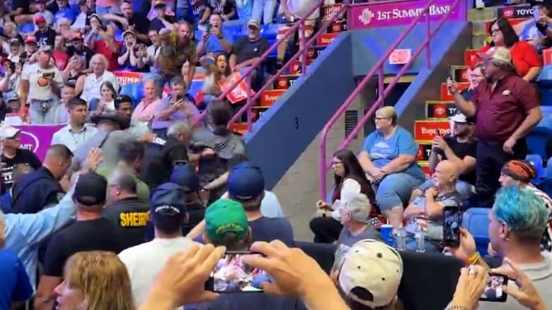 Video shows protester removed from Trump rally by security