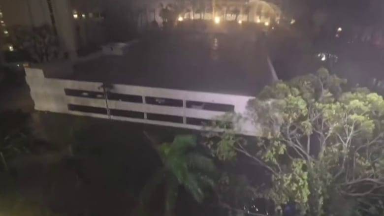 Debris swirls through air, storm surge rises in Sarasota