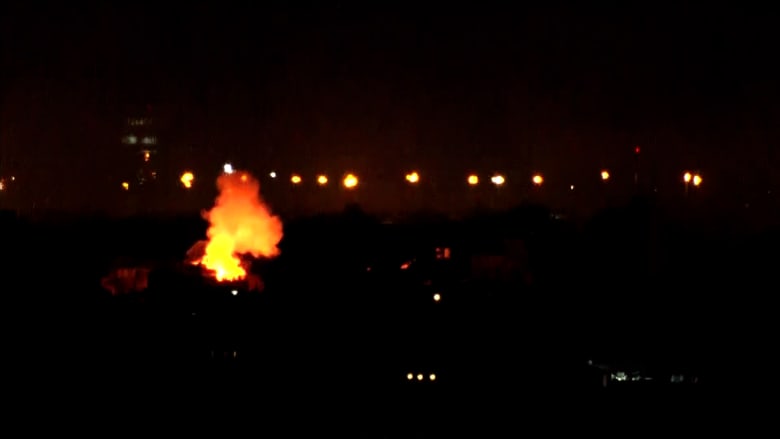 Video shows smoke and explosions in distance at Beirut airport