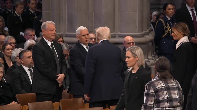 Trump and Pence shake hands at Carter's funeral service