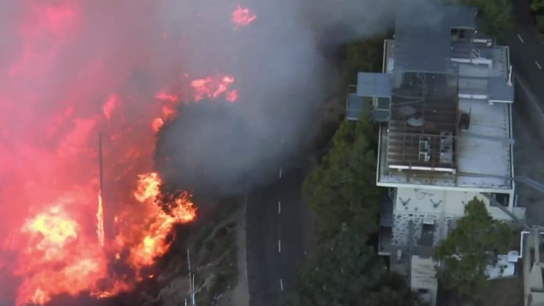 Fire burns near the summit of Mount Wilson