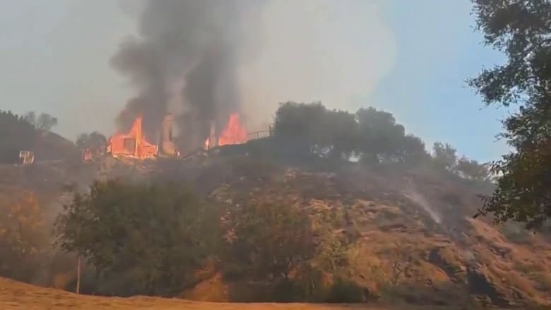 Los Angeles area schools reopen as fire containment grows