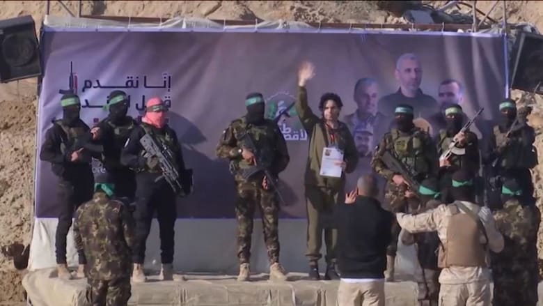 Video shows Hamas handing over first Israeli hostage in exchange