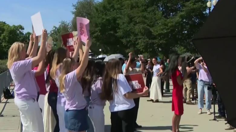 Groups supportive of state bans on transgender athletes gather outside the Supreme Court