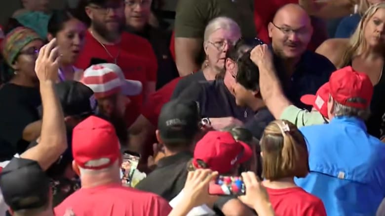 Protester grabbed by audience member at Texas Trump rally