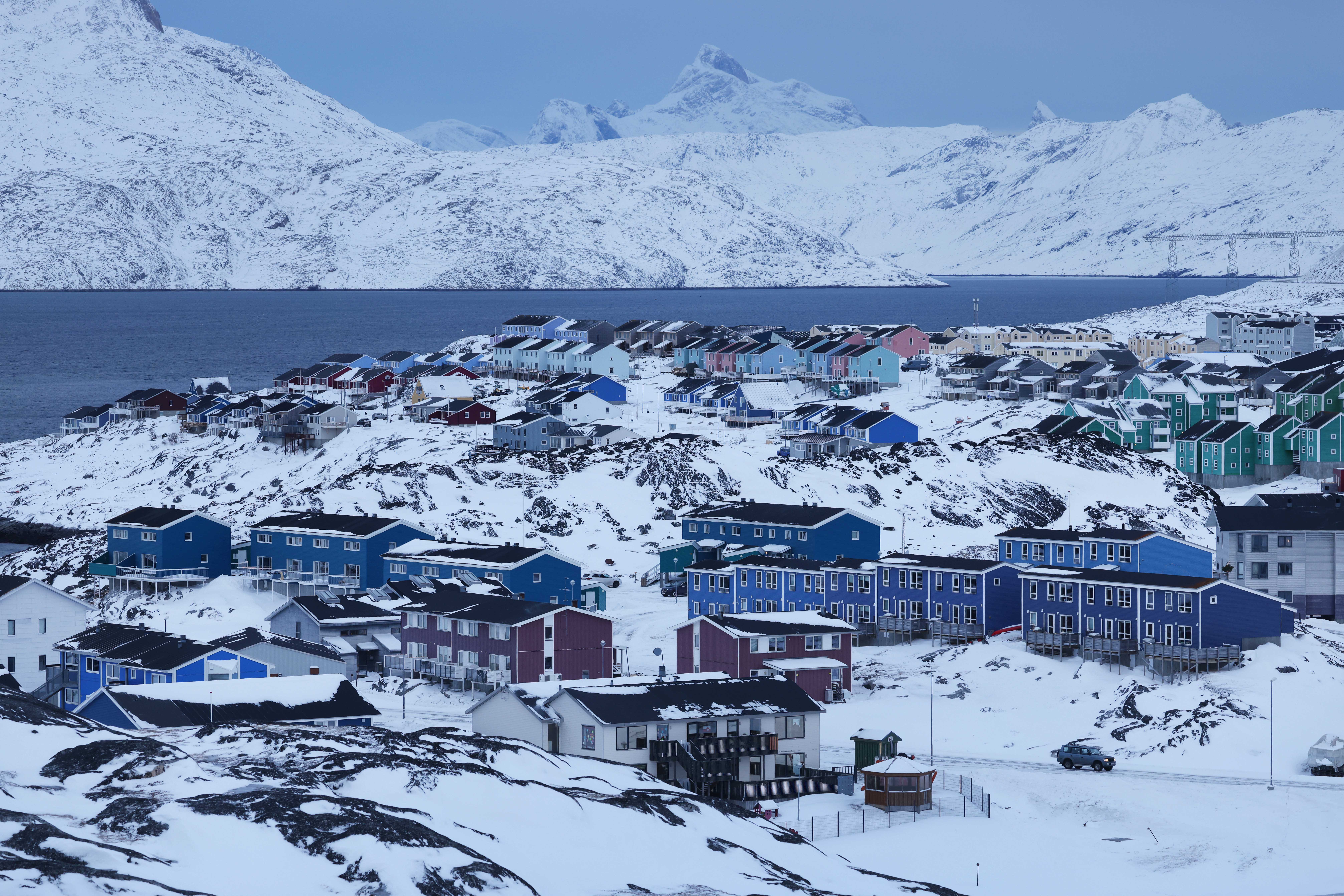 Residential apartment buildings stand among snow on January 21, 2026 in Nuuk, Greenland. 