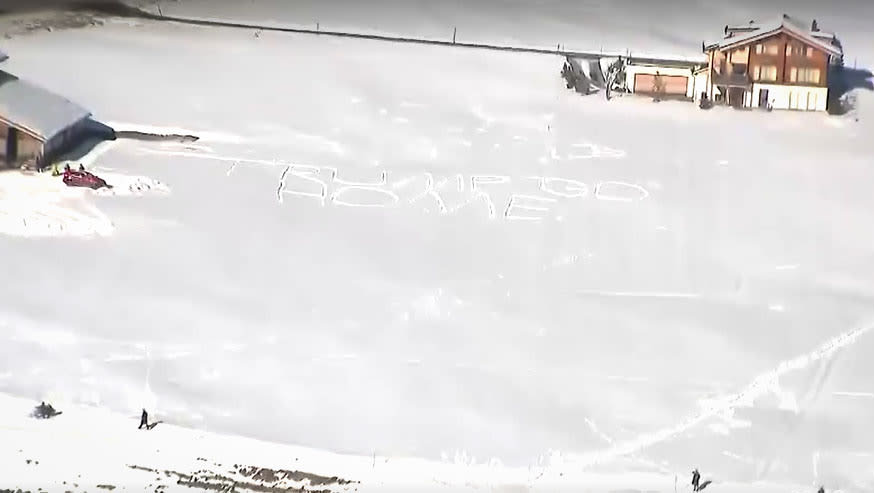 A message in the snow reads "Trump Go Home" as President Donald Trump arrives in Davos, Switzerland, on Jan. 21, 2026.