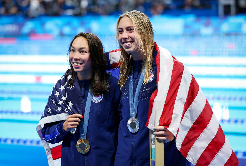 Torri Huske, left, and Gretchen Walsh pose with their medals