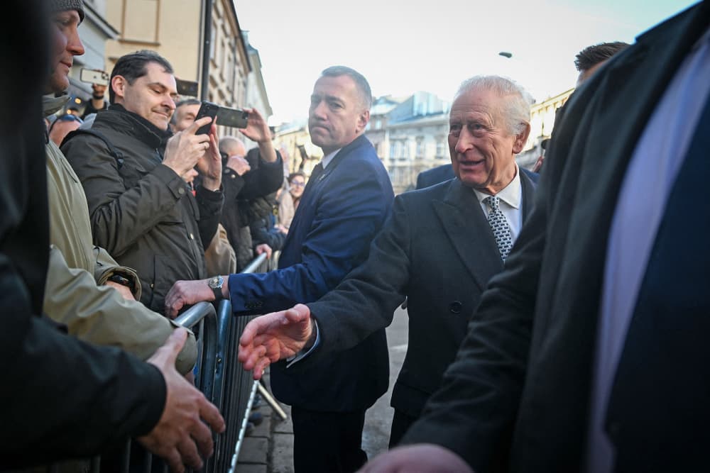 King Charles is greeted by locals as he arrives at the Jewish Community Centre in Krakow, Poland, on Jan. 27, 2025.