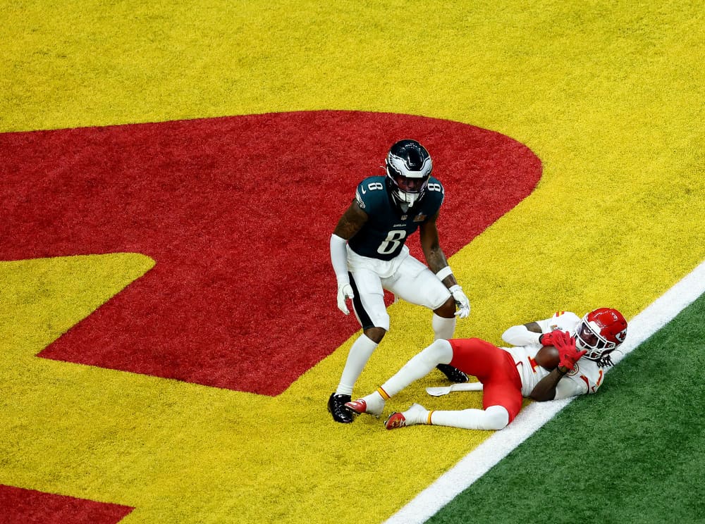 Xavier Worthy catches a pass for a touchdown in the third quarter.