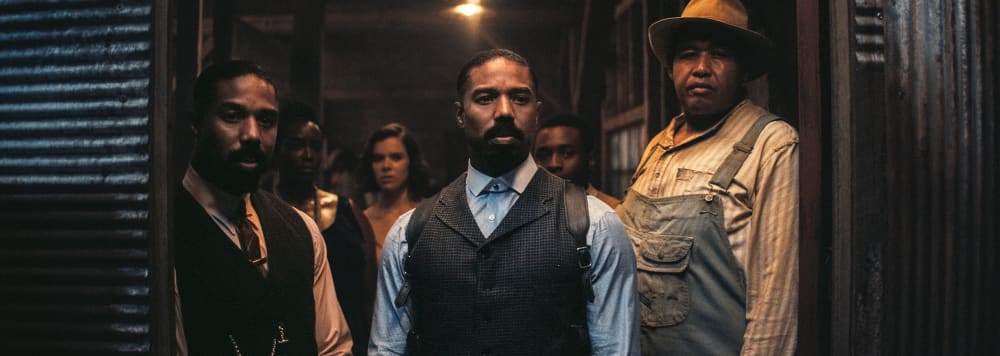 From left, Michael B. Jordan, Wunmi Mosaku, Hailee Steinfield, Miles Caton, and Omar Benson Miller stand in a doorway