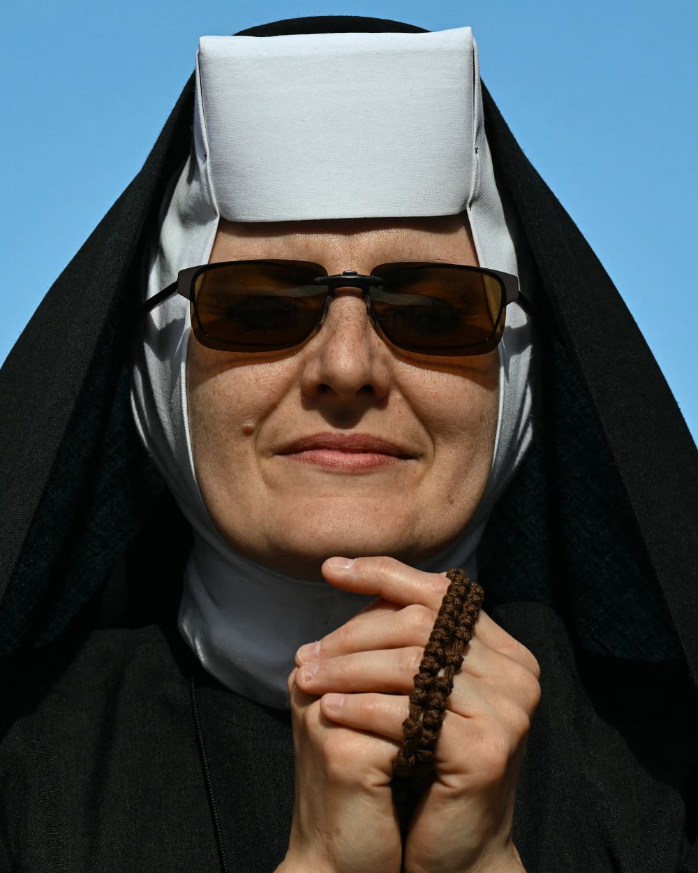 A nun prays on St. Peter's Square 