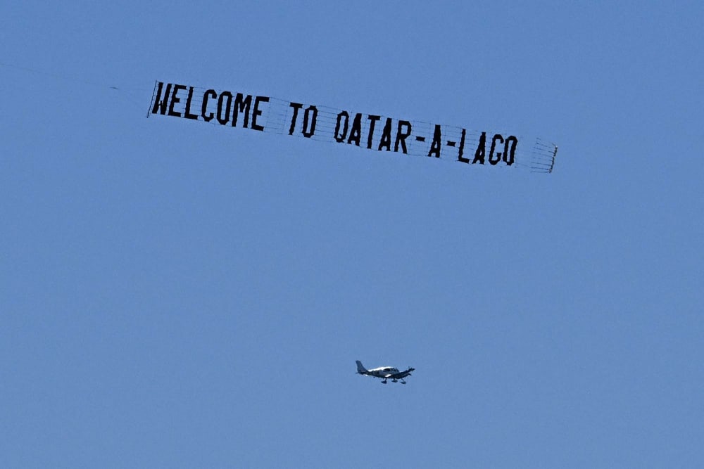 A banner with the words "Qatar-a-Lago" 