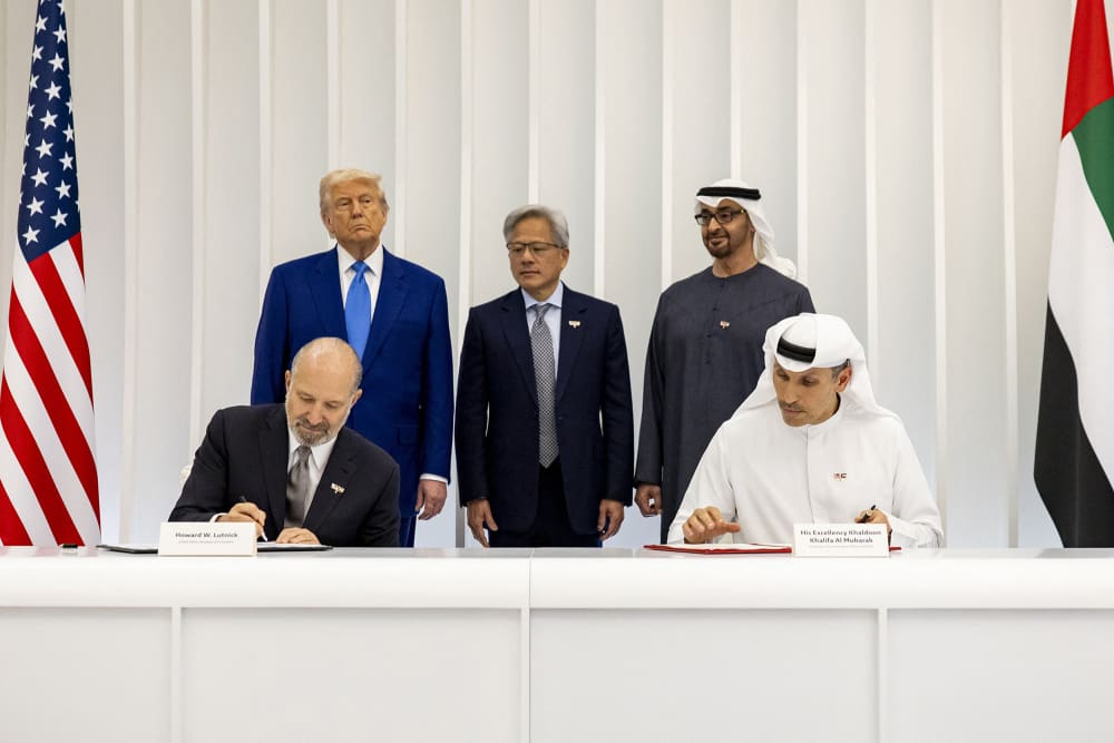 From left, President Donald Trump, Nvidia CEO Jensen Huang and UAE President Sheikh Mohamed bin Zayed al-Nahyan, look on as Commerce Secretary Howard Lutnick and Mubadala CEO Khaldoon Khalifa al-Mubarak sign an agreement on the US-UAE AI Acceleration Partnership in Abu Dhabi on May 15, 2025.