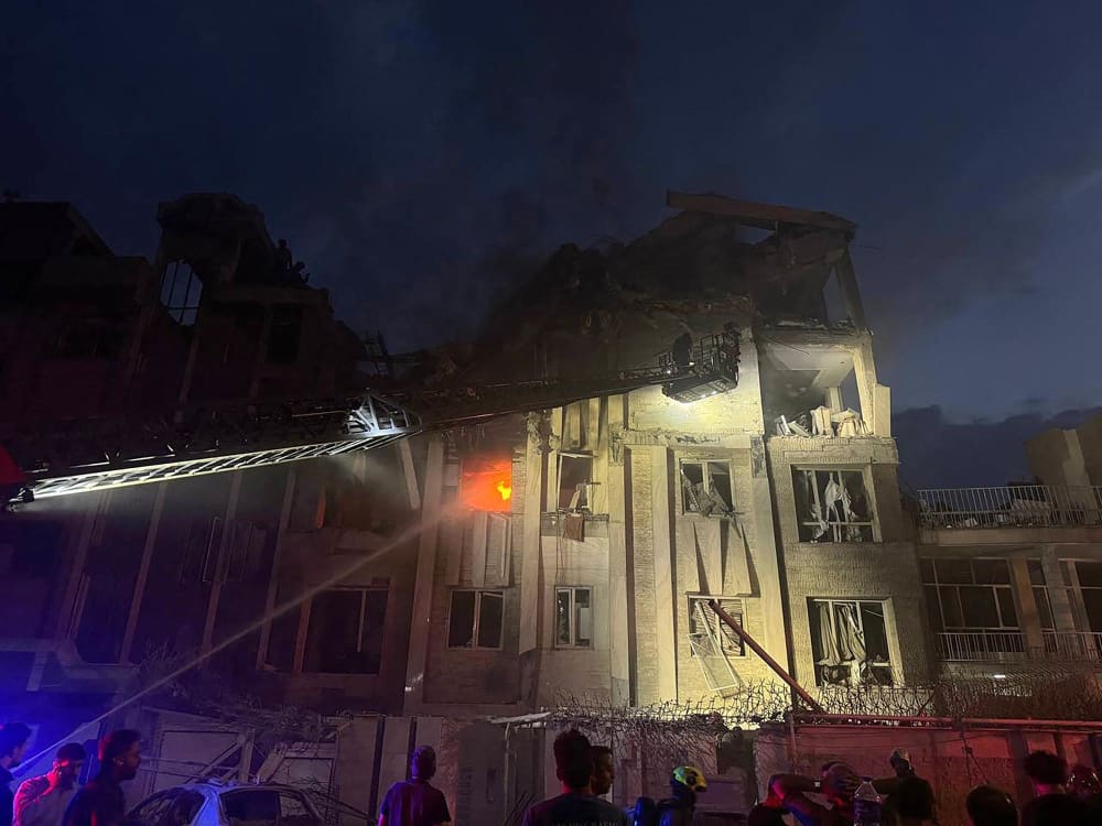 A photo released by Iran's official Sepah News Telegram channel on June 13, 2025 shows a building in Tehran reportedly hit in an Israeli strike on the Iranian capital early on June 13, 2025. 