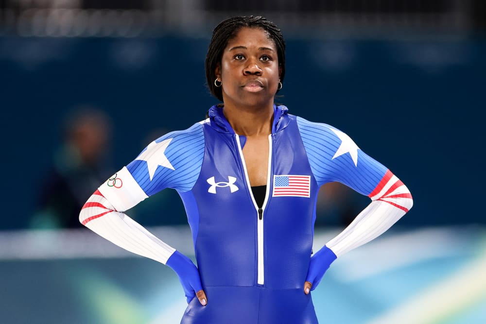 Erin Jackson looks on while standing on the ice