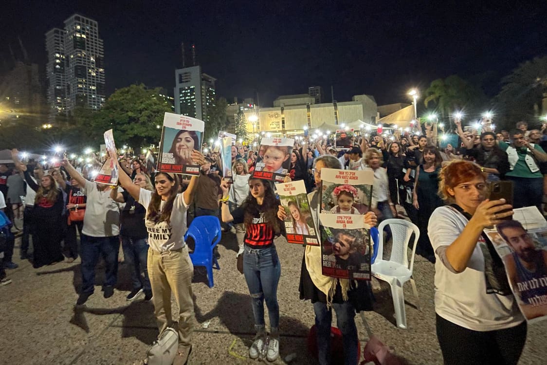 Scores of people gathered in Tel Aviv to mark one month since Hamas’ deadly Oct. 7 attack.