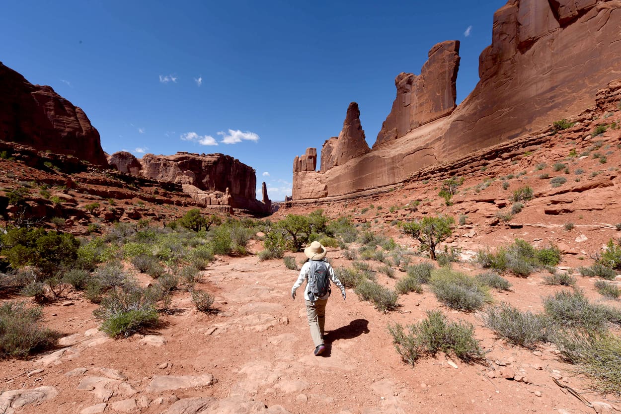 Image: Hikers on the Park Avenue trail in the Arches National Park near Moab, Utah on April 21, 2018.
