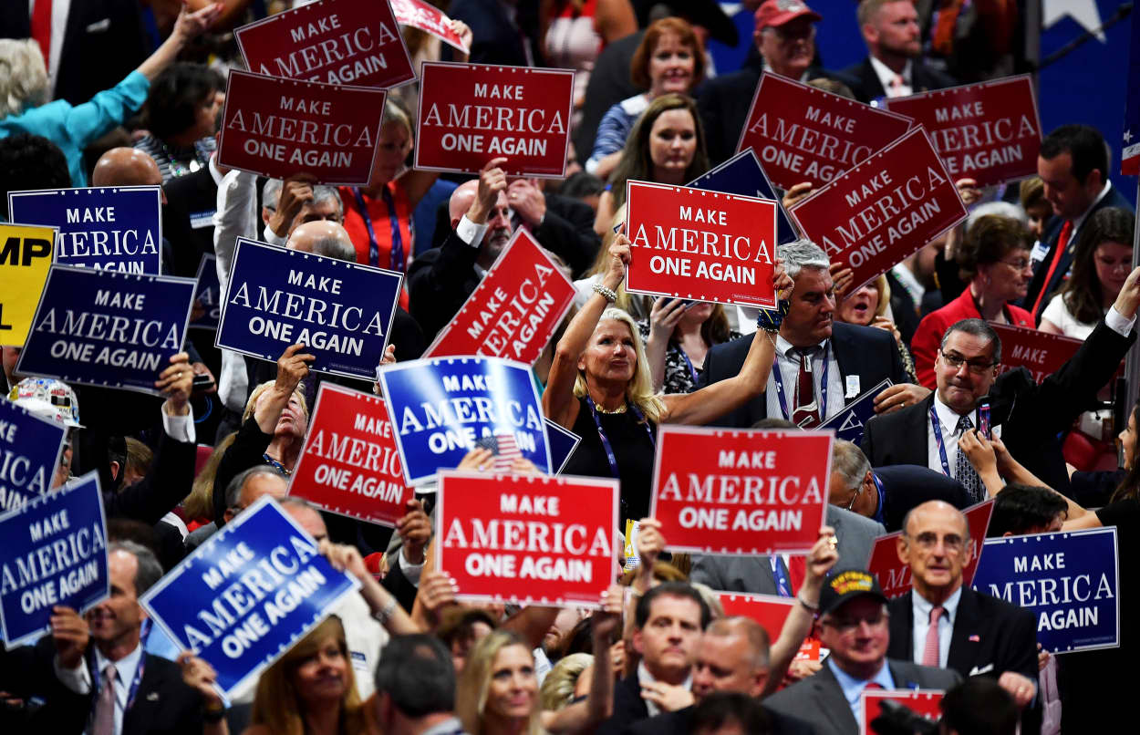Image: Delegates hold signs at the Republican National Convention in Cleveland, Ohio, on July 21, 2016.