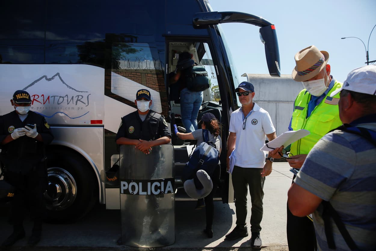 Image: U.S. citizens and residents board a bus before getting on a plane back to the United States after Peru imposed a travel ban to stop the spread of the coronavirus disease (COVID-19), in Lima