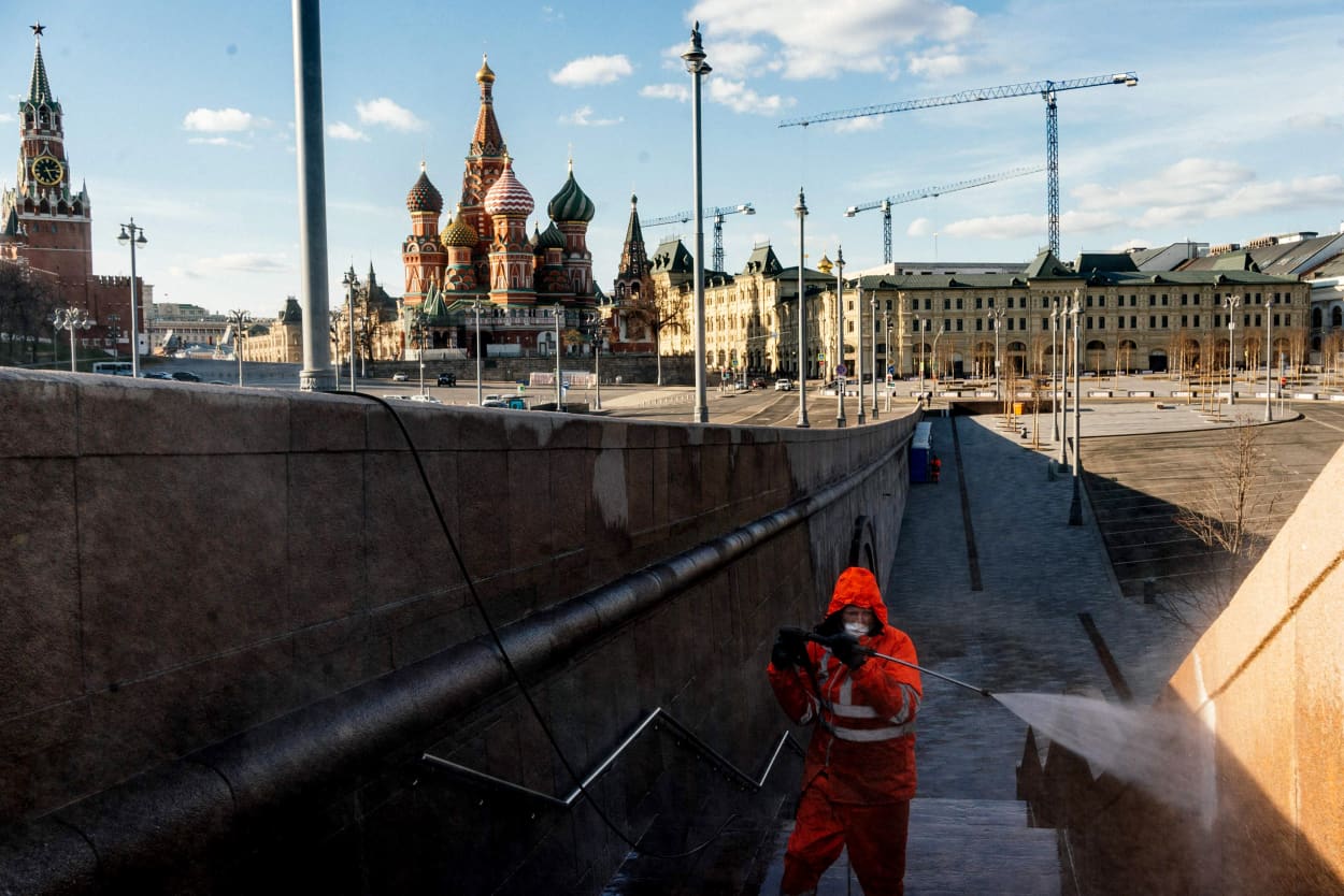 Image: A municipal worker disinfects a bridge near the Kremlin in Moscow on April 12, 2020.