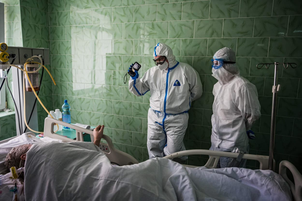 Image: Doctor Dmitry Cheboksarov (L) wearing personal protective equipment (PPE) works in the intensive care unit for the COVID-19 coronavirus patients at Vinogradov City Clinical Hospital in Moscow