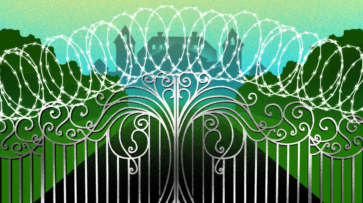 Image: An ornate gate topped with barbed wire leading to a silhouetted mansion.