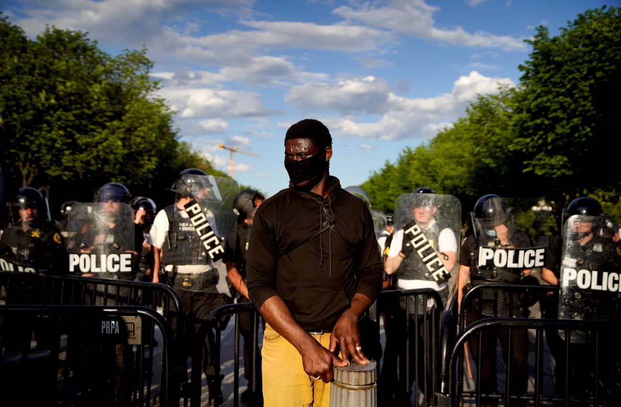 Image: A demonstrator during a rally near the White House in protest over the death of George Floyd on May 30, 2020.
