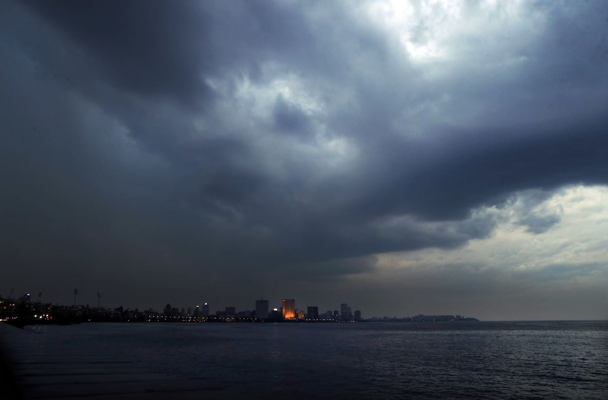 Image: Dark clouds hang over the city ahead of cyclone Nisarga making landfall in Mumbai, India