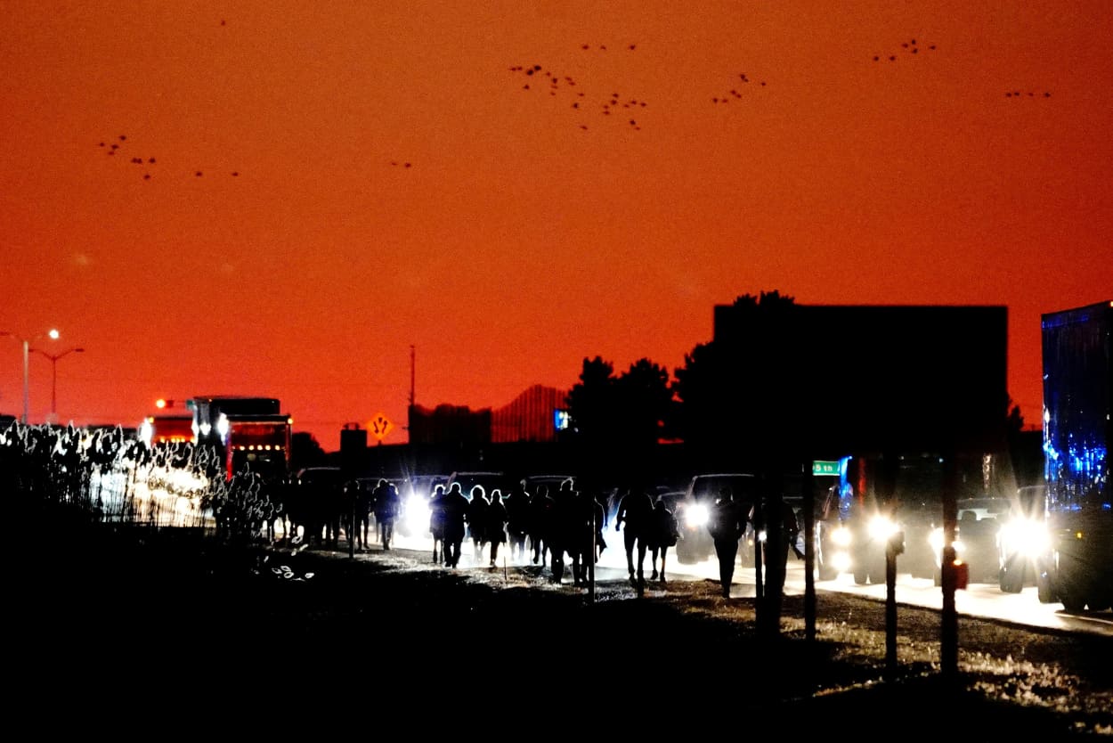 Image: Supporters of President Donald Trump walk along Highway 158 to his campaign rally at Kenosha Regional Airport in Wisconsin on Nov. 2, 2020.