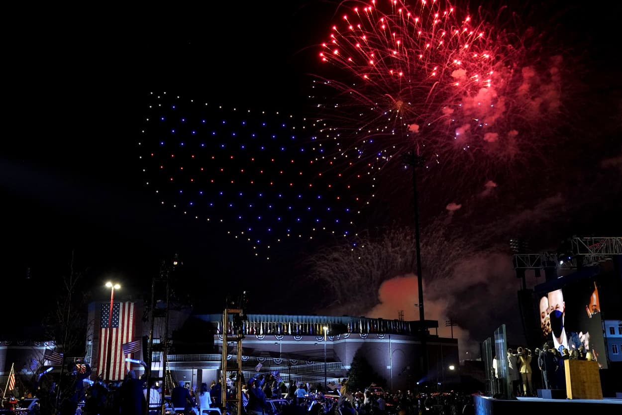 Image: President-elect Joe Biden and his family watch fireworks explode after his address to the nation in Wilmington, Del., on Saturday.