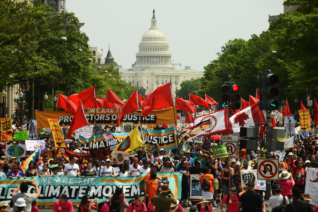 Image: People march from the U.S. Capitol to the White House for the People's Climate Movement to protest President Donald Trump's environmental policies