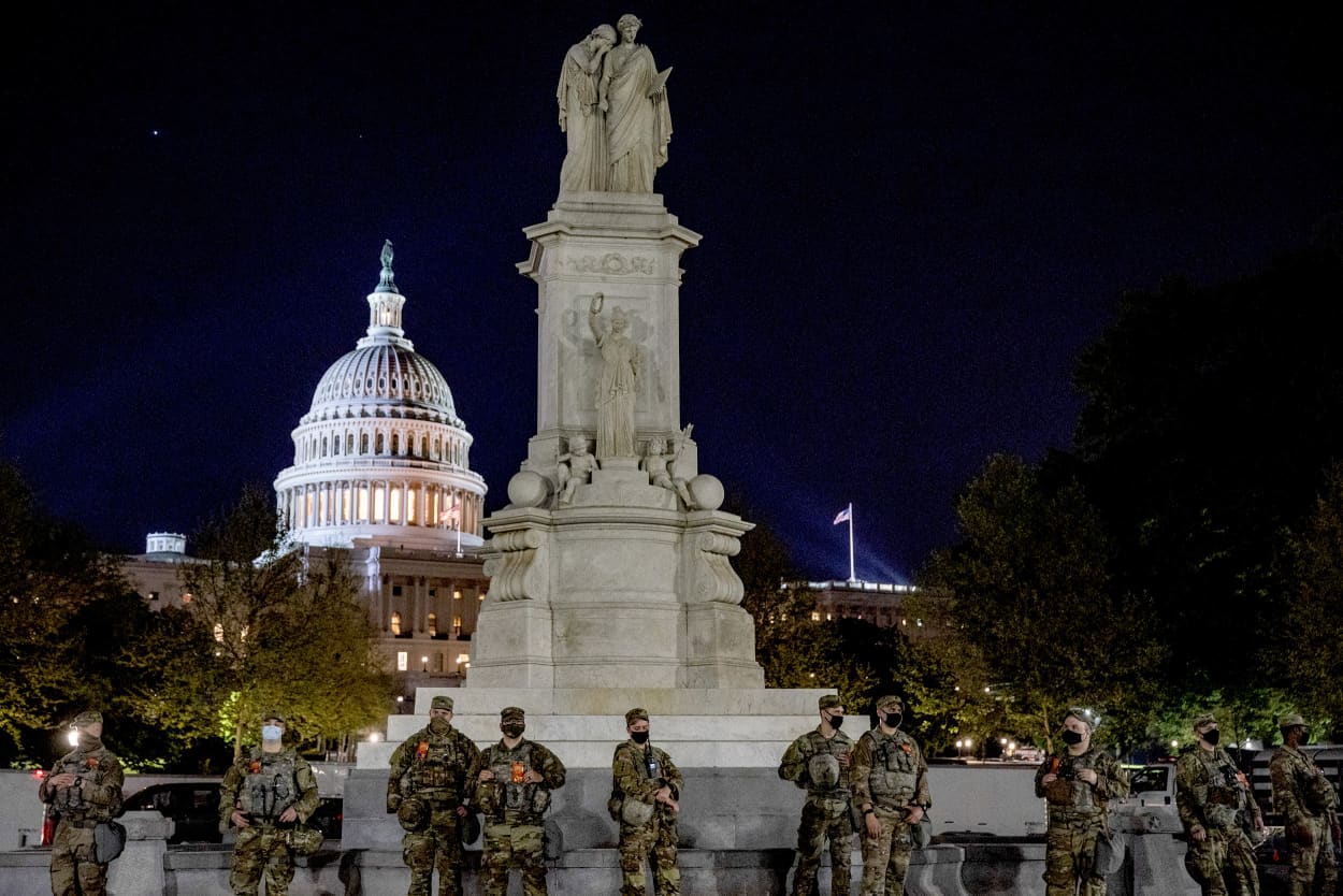 IMage: Military personnel stage near the Capitol as President Joe Biden makes his joint address to Congress on April 28, 2021.