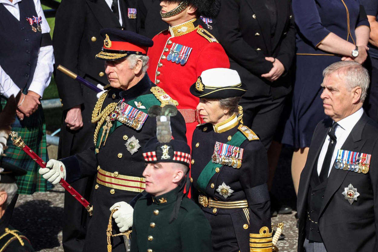 Image: King Charles III, Princess Anne, Princess Royal, and Prince Andrew, Duke of York walk behind the procession of Queen Elizabeth II's coffin, from the Palace of Holyroodhouse to St Giles Cathedral, on the Royal Mile on Sept. 12, 2022, where Queen Elizabeth II will lie at rest.