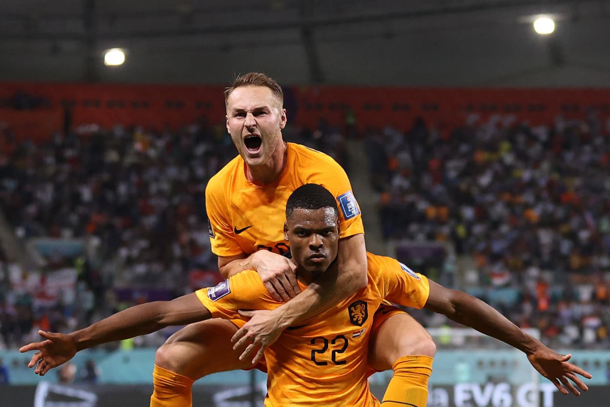 Denzel Dumfries and Teun Koopmeiners of the Netherlands celebrate during the World Cup match against the United States