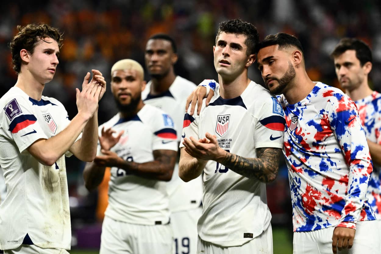 United States players react at the end of the World Cup match