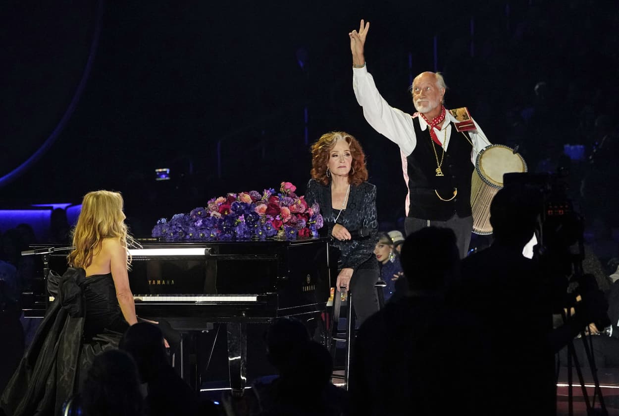 Sheryl Crow, left, Bonnie Raitt and Mick Fleetwood perform "Songbird" during a tribute to the late singer Christine McVie.